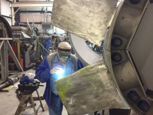 Paul examining a fan blade for interior cracks